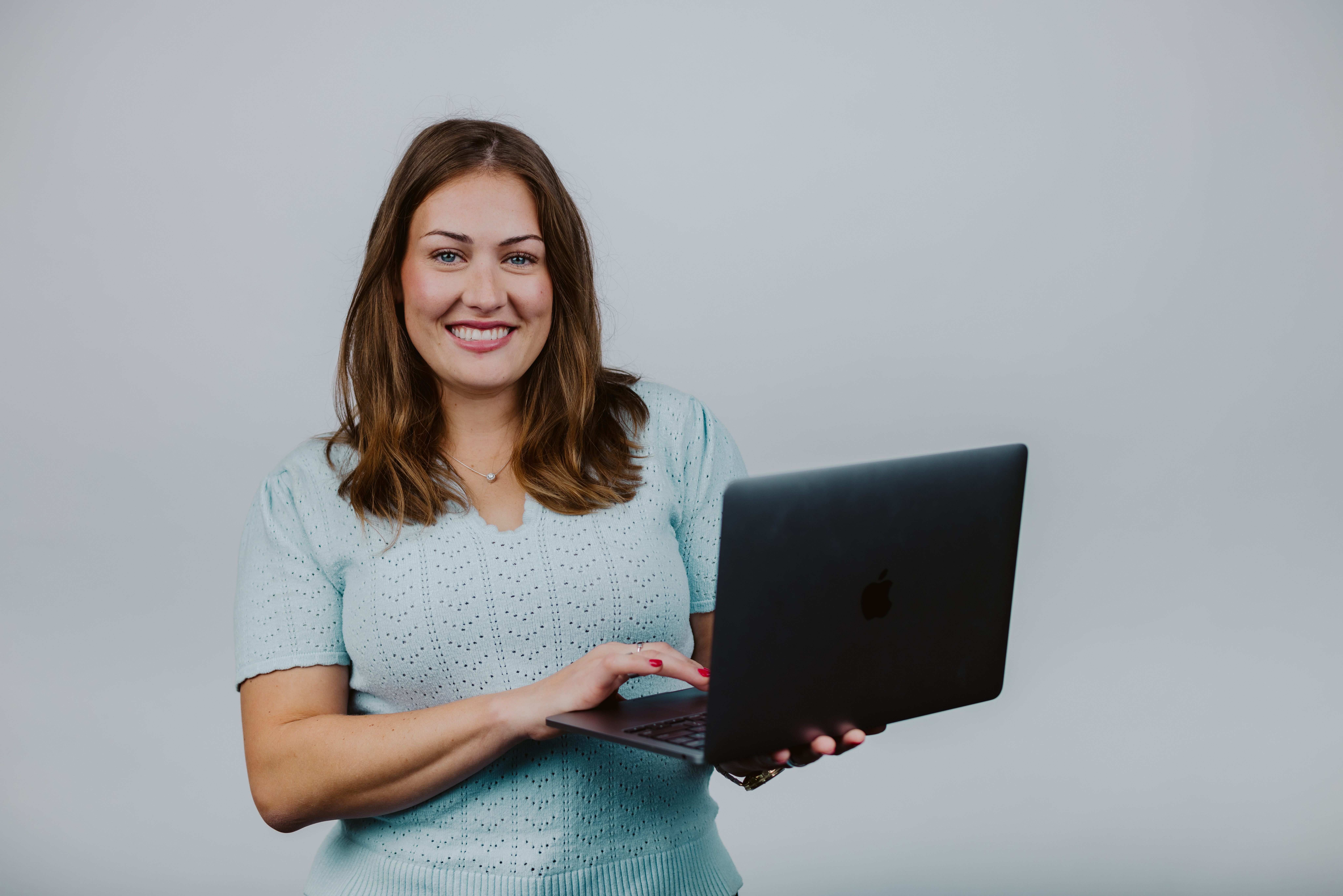 Woman Holding Laptop